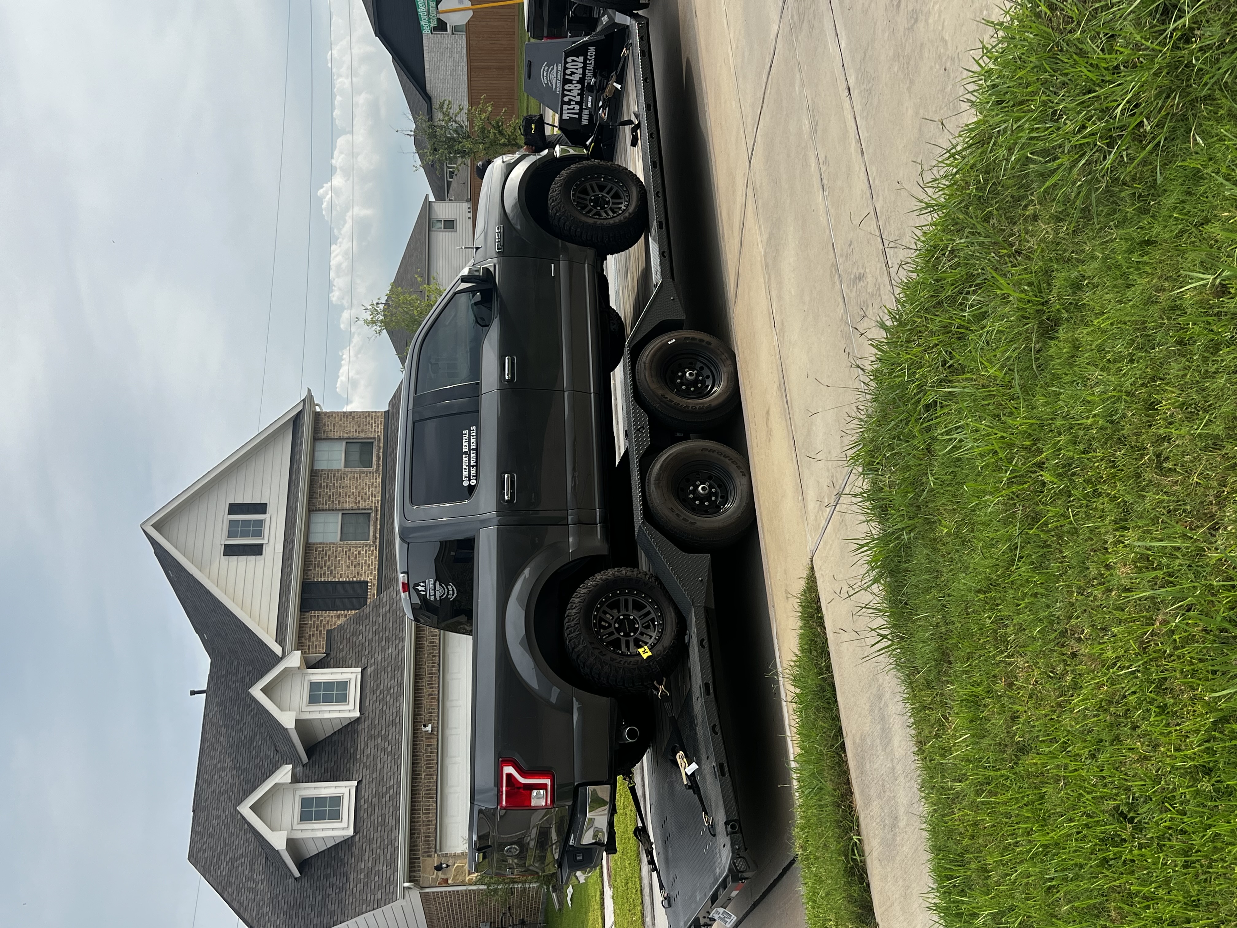 24ft drive over flatbed trailer rental with Ford F-150 truck loaded, available in Humble TX