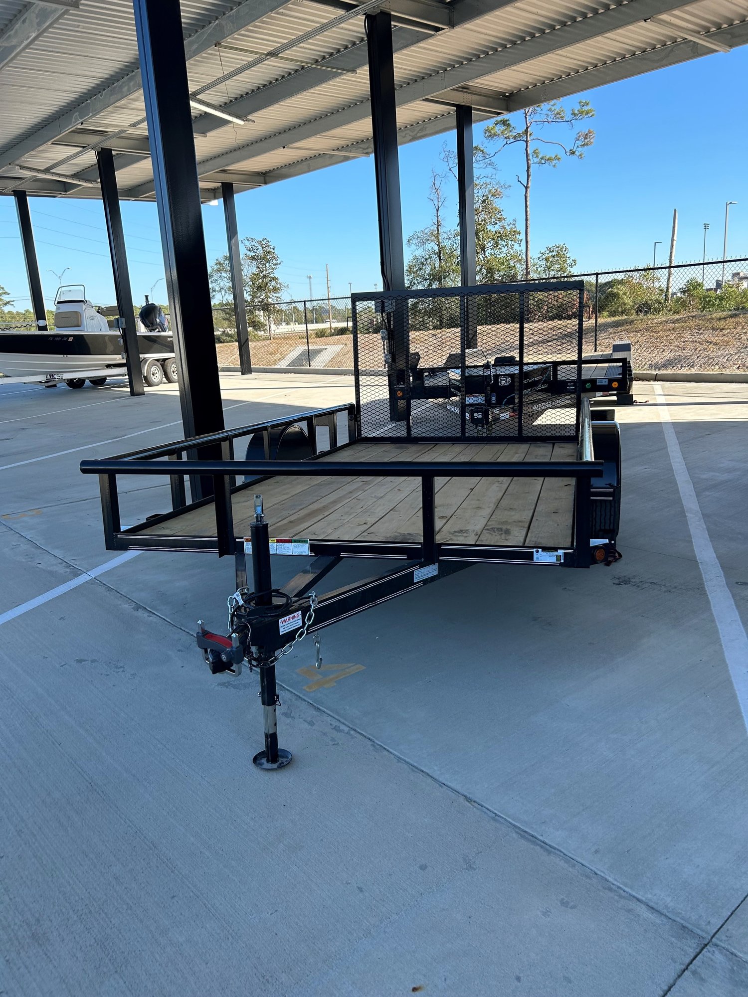 12ft utility trailer rental with mesh sides, ideal for home projects and small business in Houston